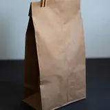 Uploaded photo, square: a plain paper bag of coffee beans.